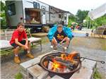 Kids roasting marshmallows at LAKE GEORGE ESCAPE CAMPGROUND - thumbnail