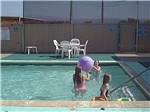 Kids swimming in the pool at BETABEL RV PARK - thumbnail