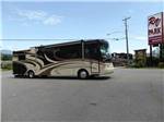 A class A motorhome in front of the resort at COTTONWOOD MEADOWS RV COUNTRY CLUB - thumbnail