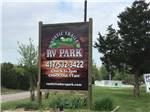 The front entrance sign at RUSTIC TRAILS RV PARK - thumbnail