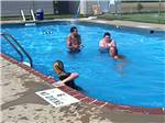 People playing in the swimming pool at TOWN & COUNTRY CAMP RESORT - thumbnail