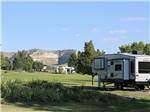 Fifth wheel trailer parked in a RV site at ROBIDOUX RV PARK - thumbnail