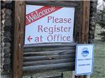 Sign indicating that guests need to register at ROBIDOUX RV PARK - thumbnail