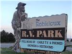 Statue over sign indicating Robidoux RV Park at ROBIDOUX RV PARK - thumbnail