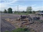 Relic of a wagon with lawn and trees in background at ROBIDOUX RV PARK - thumbnail