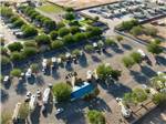 Aerial view of RVs in camp surrounded by trees at TOWN & COUNTRY RV PARK - thumbnail