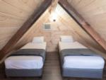 Beds in the loft of the camping cabin at SUN OUTDOORS PIGEON FORGE - thumbnail