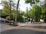 Campers conversing in group beside RV at CAMPGROUND AT BARNES CROSSING - thumbnail