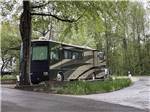 A Class A motorhome in an RV site at CAMPGROUND AT BARNES CROSSING - thumbnail