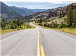 A road running thru a valley at CODY YELLOWSTONE - thumbnail