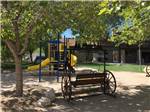 Playground with swing at BOULDER CREEK RV RESORT - thumbnail