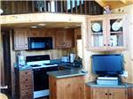 Kitchen area inside cabin at BOULDER CREEK RV RESORT - thumbnail