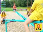 Kids playing in the playground at MILTON KOA - thumbnail