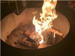 A fire in the fire pit at SHERWOOD FOREST CAMPGROUND - thumbnail