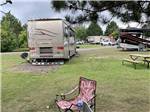 A motorhome in a back in RV site at SHERWOOD FOREST CAMPGROUND - thumbnail