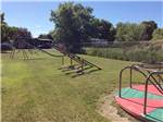 Playground with swing at BILLINGS VILLAGE RV PARK - thumbnail