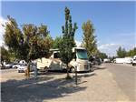 RV parked in a gravel site at COEUR D'ALENE RV RESORT - thumbnail