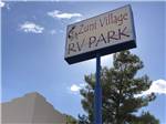 Park sign under a blue sky at ZUNI VILLAGE RV PARK - thumbnail