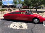 Electric car on Route 66 sign at ZUNI VILLAGE RV PARK - thumbnail