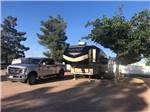 Fifth wheel parked in campsite at ZUNI VILLAGE RV PARK - thumbnail