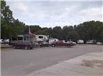 Various trailers parked on-site at OUTDOOR LIVING CENTER RV PARK - thumbnail