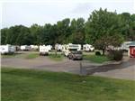 Paved road leading to RV spots at OUTDOOR LIVING CENTER RV PARK - thumbnail
