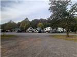 Gravel road leading to RVs at OUTDOOR LIVING CENTER RV PARK - thumbnail