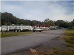 Paved road leading to open area for RVs at OUTDOOR LIVING CENTER RV PARK - thumbnail