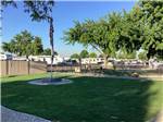 Grassy area with American flag at HI VALLEY RV PARK - thumbnail