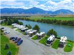 RVs parked in waterfront sites at YELLOWSTONE'S EDGE RV PARK - thumbnail