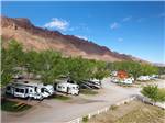 Aerial view of RVs with mountains in background at SPANISH TRAIL RV PARK - thumbnail