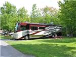 A motorhome in a back in RV site at THE VILLAGES AT TURNING STONE RV PARK - thumbnail