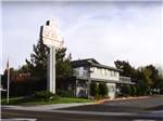 The front entrance sign and building at VICTORIAN RV PARK - thumbnail