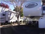 A fifth wheel trailer in a RV site at VICTORIAN RV PARK - thumbnail
