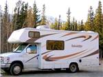 Large Sunseeker RV parked before large trees at ANCHORAGE SHIP CREEK RV PARK - thumbnail