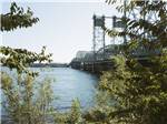 A metal bridge over a river at VANCOUVER RV PARK - thumbnail