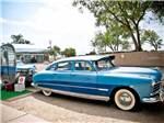 Vintage Trailer and blue vintage car at ENCHANTED TRAILS RV PARK & TRADING POST - thumbnail