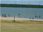 People on the beach at LOYD PARK CAMPING CABINS & LODGE - thumbnail