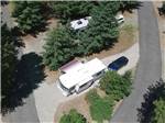 An aerial view of a pull thru RV site at WHISPERING PINES RV CAMPGROUND - thumbnail