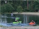 People kayaking on the water at WHISPERING PINES RV CAMPGROUND - thumbnail