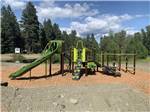 The playground equipment at WHISPERING PINES RV CAMPGROUND - thumbnail