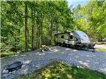 A travel trailer parked in a gravel site at SMOKY BEAR CAMPGROUND AND RV PARK - thumbnail