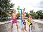 A group of boys playing in the water park at BIG MEADOW FAMILY CAMPGROUND - thumbnail