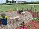 Sitting area with benches made from stone at KELLOGG RV PARK - thumbnail