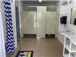 Bathroom with showers and stalls at KELLOGG RV PARK - thumbnail
