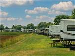 A line of grassy RV sites at GRAND HINCKLEY RV RESORT - thumbnail