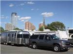 SUV parked with camper attached at LIBERTY HARBOR MARINA & RV PARK - thumbnail