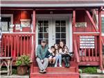 A family outside the general store at RIVER BEND RESORT - thumbnail