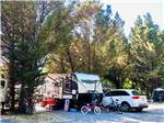 A travel trailer parked on-site at RIVER BEND RESORT - thumbnail