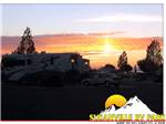 RV sites with the sun setting in the background at SUSANVILLE RV PARK - thumbnail